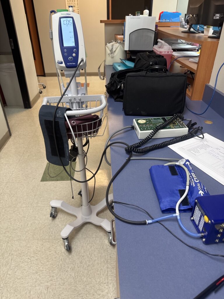 Vital signs monitor beside biomedical test equipment