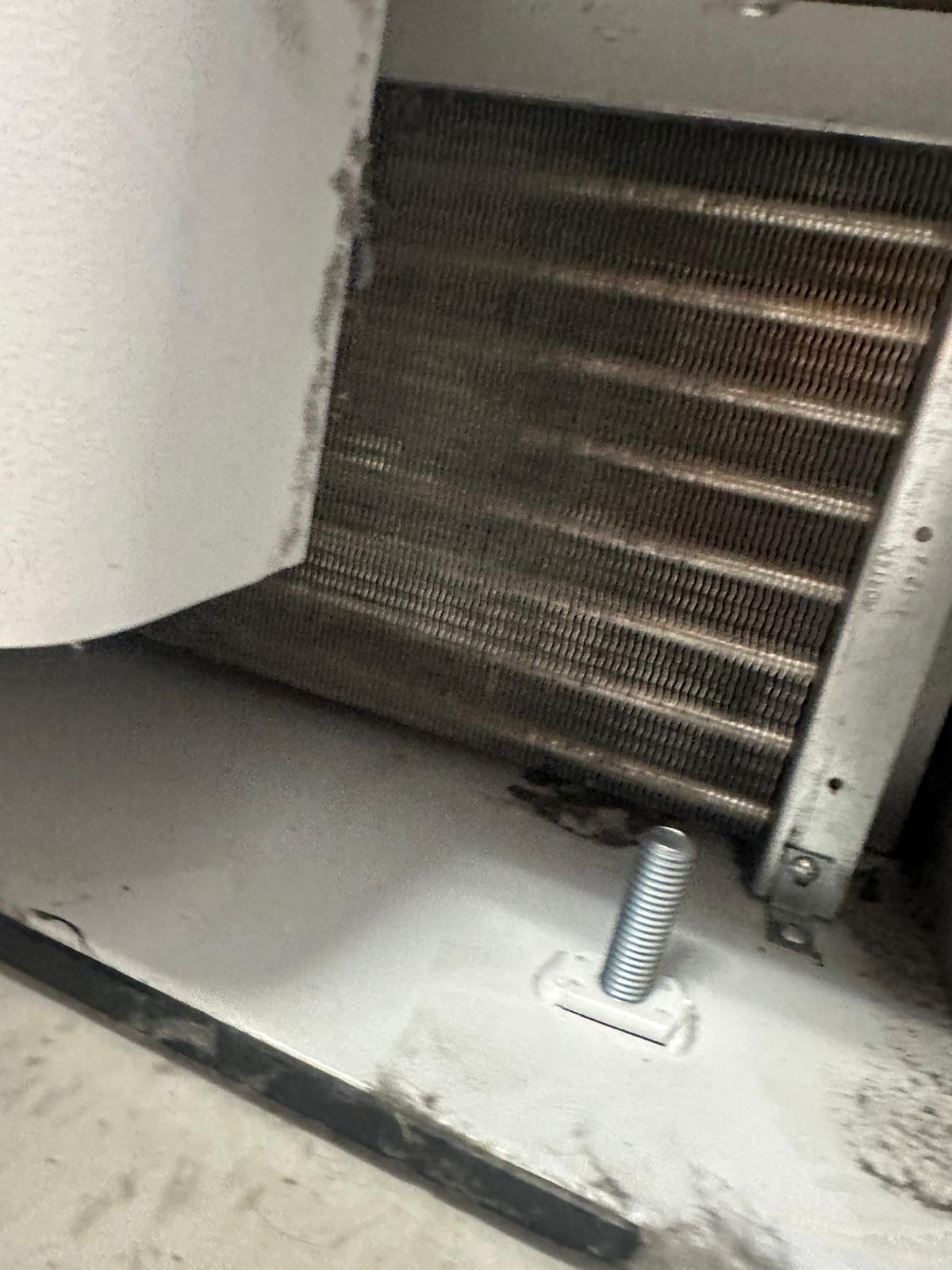 Laboratory freezer lower compartment and heat exchanger during maintenance