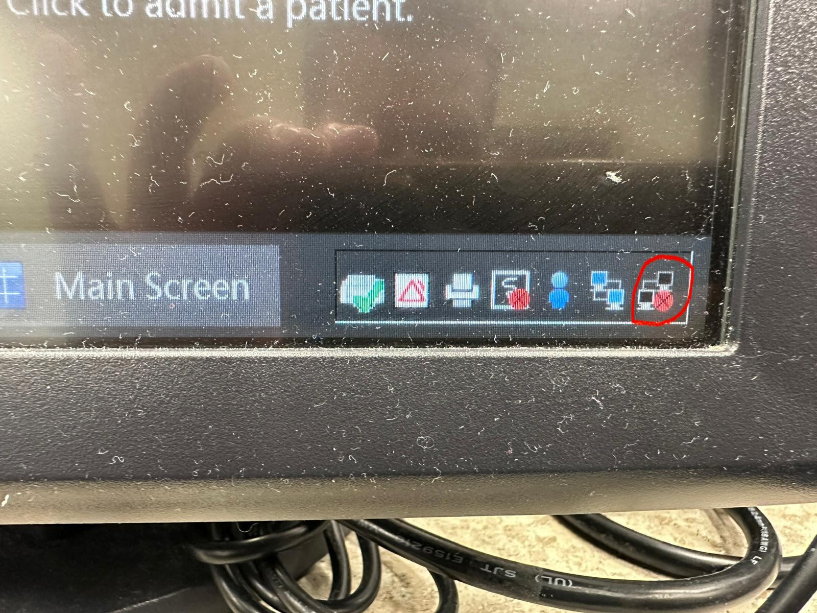 Close-up of central-monitoring system status icons.
